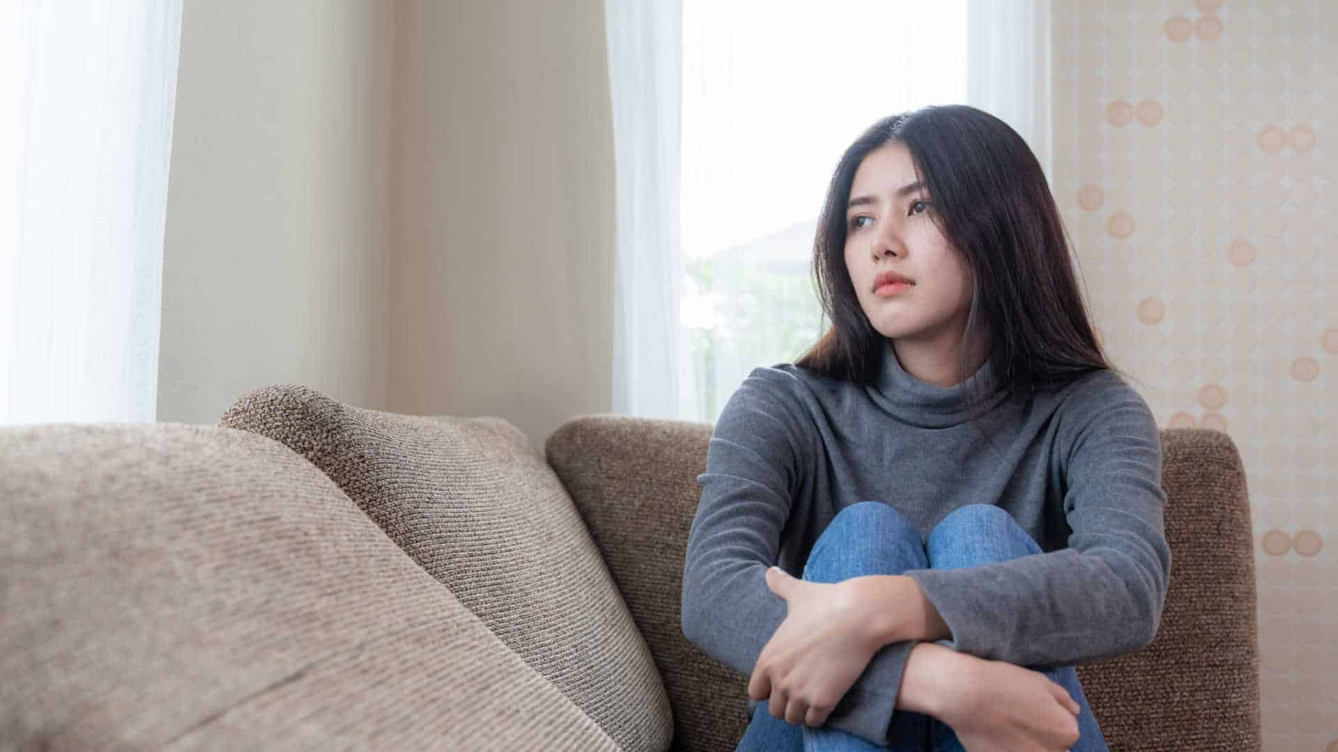 sad-woman-on-couch